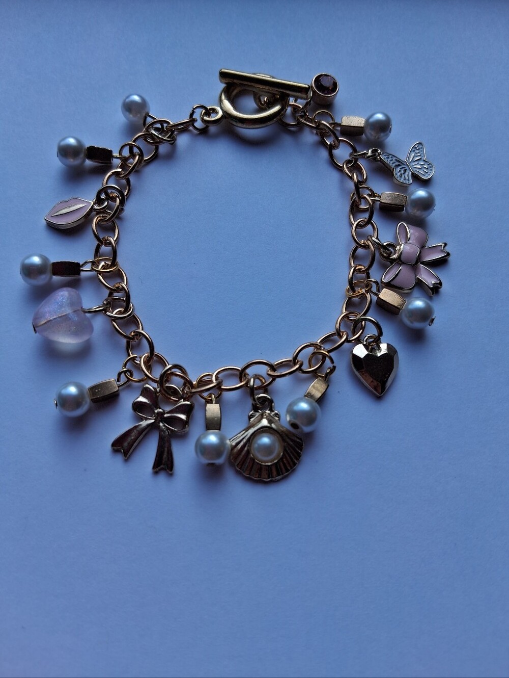 Hand Crafted Gold-Tone Charm Bracelet with Pink Accents and Pearls